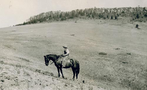 Berneta on horseback at Wall Mountain, near the Doig homestead